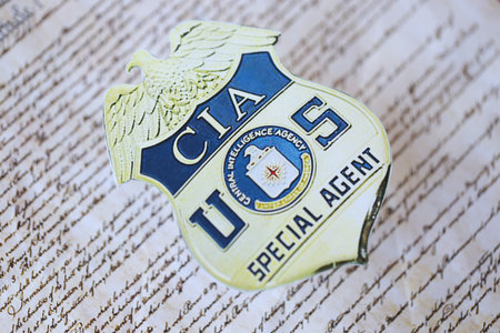 KYIV, UKRAINE - MARCH 9, 2024 US CIA Central Intelligence Agency badge on United States Constitution...