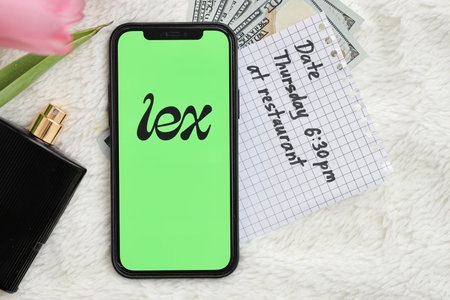 KYIV, UKRAINE - FEBRUARY 23, 2024 Lex logo of famous dating website or app on iPhone display screen...