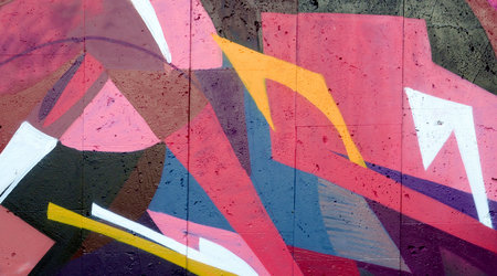 Colorful background of graffiti painting artwork with bright aerosol outlines on wall. Old school...
