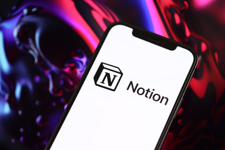 KYIV, UKRAINE - MARCH 17, 2024 Notion logo on iPhone display screen with background of artificial...