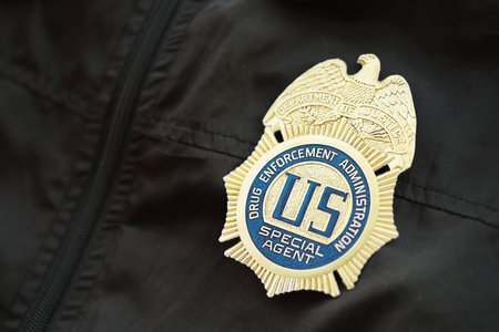 KYIV, UKRAINE - MARCH 9, 2024 US DEA Special Agent badge on black jacket uniform close up