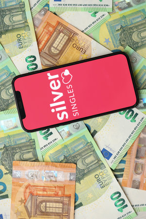 KYIV, UKRAINE - FEBRUARY 23, 2024 Silver Singles logo of famous dating website or app on iPhone...