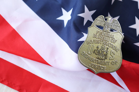 KYIV, UKRAINE - MARCH 9, 2024 US FBI Federal Bureau of Investigation badge on United States of America flag close upのeditorial素材