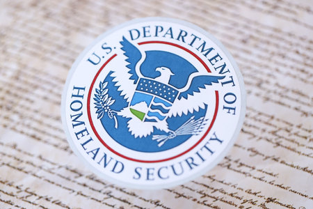 KYIV, UKRAINE - MARCH 9, 2024 US Department of Homeland Security seal on United States Constitution close upのeditorial素材