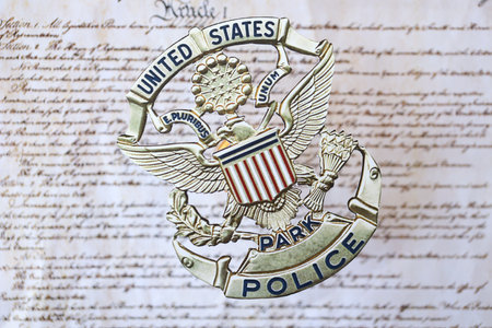 KYIV, UKRAINE - MARCH 9, 2024 US United States Park Police badge on United States Constitution close...
