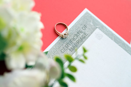Canadian Certificate of registration of marriage blank document and wedding ring close upの写真素材