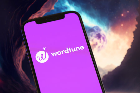 KYIV, UKRAINE - MARCH 17, 2024 Wordtune logo on iPhone display screen with background of artificial intelligence futuristic ai generated image close upのeditorial素材