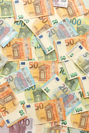 Many european euro money bills. Lot of banknotes of european union currency close upの写真素材