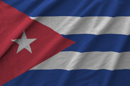 Cuba flag depicted on folded wavy fabric of old cloth close up