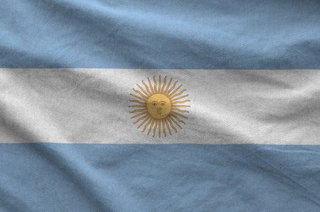 Argentina flag depicted on folded wavy fabric of old cloth close upの写真素材