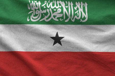 Somaliland flag depicted on folded wavy fabric of old cloth close upの写真素材