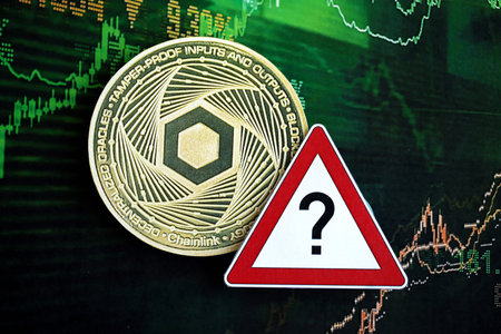 KYIV, UKRAINE - AUGUST 17, 2024 Chainlink LINK coin and red paper question sign on chart background...