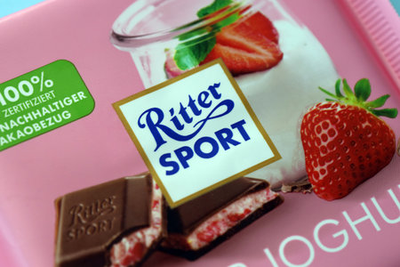 KYIV, UKRAINE - AUGUST 17, 2024 Ritter Sport logotype on small chocolate bar in wrapping close upのeditorial素材