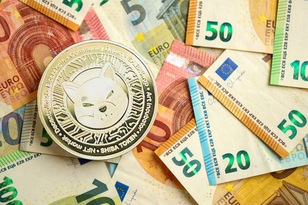 KYIV, UKRAINE - AUGUST 17, 2024 Shiba coin with big amount of european euro bills close upのeditorial素材