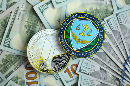 KYIV, UKRAINE - AUGUST 17, 2024 Avalanche AVAX coin and US Federal Trade Commission sign on many USD...