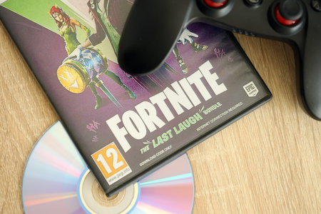 KYIV, UKRAINE - JUNE 26, 2024 Fortnite Last Laugh bundle PS5 video game disc box for console gaming....