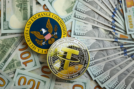 KYIV, UKRAINE - AUGUST 17, 2024 Tether USDT coin and US Securities and Exchange Commission sign on money background close upのeditorial素材