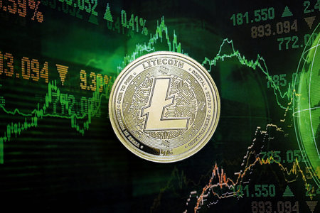 KYIV, UKRAINE - AUGUST 17, 2024 Litecoin LTC coin on dark cryptocurrency digital trading chart in green colors close upのeditorial素材