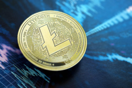 KYIV, UKRAINE - AUGUST 17, 2024 Litecoin LTC coin on abstract fictional cryptocurrency trading chart in blue color close upのeditorial素材