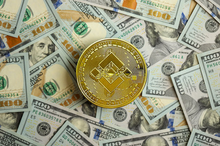 KYIV, UKRAINE - AUGUST 17, 2024 Binance BNB coin on big amount of hundred US dollar bills close upのeditorial素材
