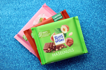 KYIV, UKRAINE - AUGUST 17, 2024 Ritter Sport logotype on small chocolate bar in wrapping close upのeditorial素材
