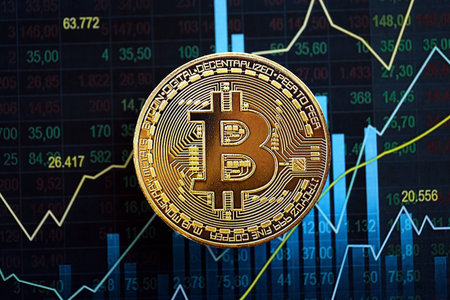 KYIV, UKRAINE - AUGUST 17, 2024 Bitcoin BTC coin on abstract fictional candlesticks in trading chart in blue color close upのeditorial素材