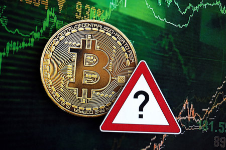 KYIV, UKRAINE - AUGUST 17, 2024 Bitcoin BTC coin and red paper question sign on chart background close upのeditorial素材