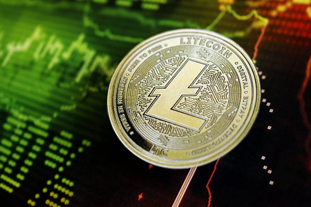 KYIV, UKRAINE - AUGUST 17, 2024 Litecoin LTC coin on dark cryptocurrency digital trading chart in green and red colors close upのeditorial素材