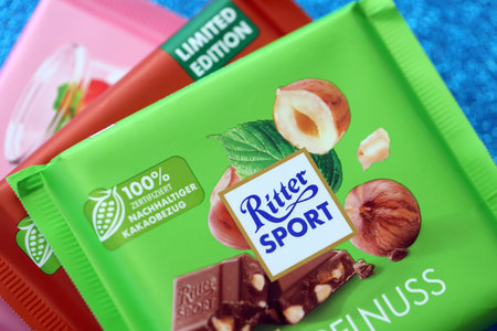 KYIV, UKRAINE - AUGUST 17, 2024 Ritter Sport logotype on small chocolate bar in wrapping close upのeditorial素材