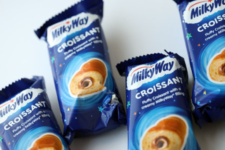 KYIV, UKRAINE - AUGUST 17, 2024 Milkyway croissants in blue wrappings with original logo close upのeditorial素材