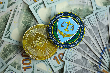 KYIV, UKRAINE - AUGUST 17, 2024 Binance BNB coin and US Federal Trade Commission sign on many USD dollar money bills close upのeditorial素材