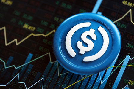 KYIV, UKRAINE - AUGUST 17, 2024 USDC stable coin on abstract fictional candlesticks in trading chart in blue color close upのeditorial素材