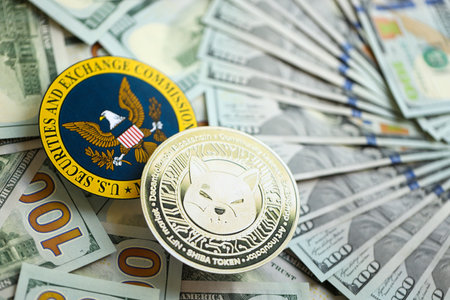 KYIV, UKRAINE - AUGUST 17, 2024 Shiba coin and US Securities and Exchange Commission sign on money background close upのeditorial素材