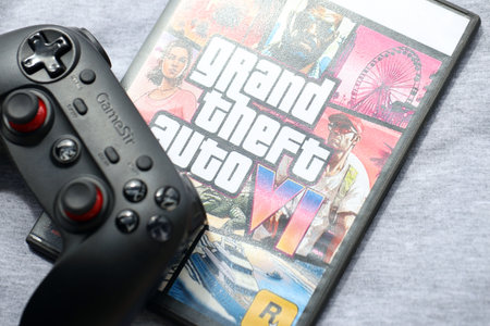 KYIV, UKRAINE - JUNE 26, 2024 Grand Theft Auto 6 PS5 video game disc box for console gaming. Fictional fan-made video game disc pack cover close upのeditorial素材