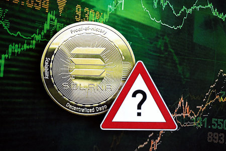 KYIV, UKRAINE - AUGUST 17, 2024 Solana SOL coin and red paper question sign on chart background close upのeditorial素材