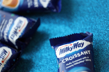 KYIV, UKRAINE - AUGUST 17, 2024 Milkyway croissants in blue wrappings with original logo close upのeditorial素材