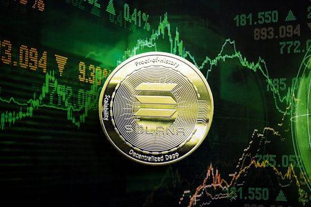 KYIV, UKRAINE - AUGUST 17, 2024 Solana SOL coin on dark cryptocurrency digital trading chart in green colors close upのeditorial素材