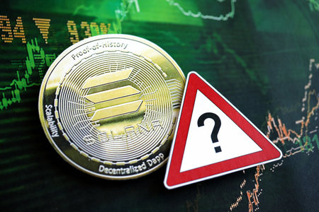 KYIV, UKRAINE - AUGUST 17, 2024 Solana SOL coin and red paper question sign on chart background close upのeditorial素材