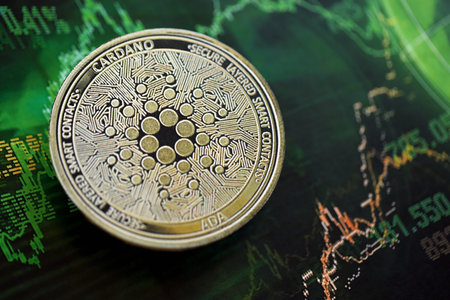 KYIV, UKRAINE - AUGUST 17, 2024 Cardano ADA coin on dark cryptocurrency digital trading chart in green colors close upのeditorial素材