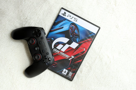 KYIV, UKRAINE - JUNE 26, 2024 Gran Turismo 7 PS5 video game disc box for console gaming. Popular video game disc close upのeditorial素材