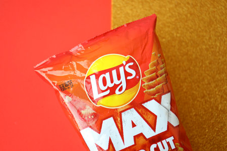 KYIV, UKRAINE - AUGUST 17, 2024 Lays MAX potato chips with pepper flavour close upのeditorial素材