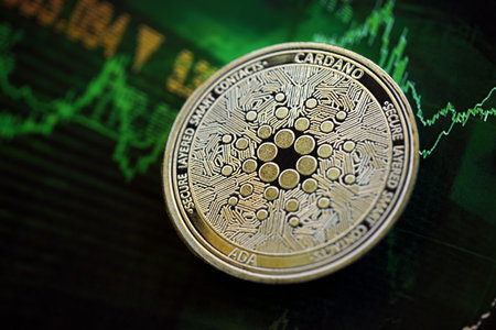 KYIV, UKRAINE - AUGUST 17, 2024 Cardano ADA coin on dark cryptocurrency digital trading chart in green colors close upのeditorial素材