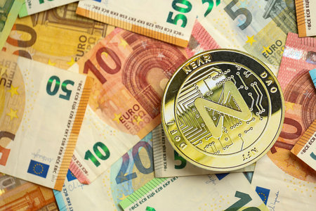 KYIV, UKRAINE - AUGUST 17, 2024 NEAR coin with big amount of european euro bills close upのeditorial素材