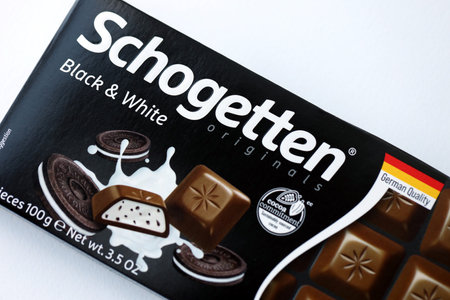 KYIV, UKRAINE - AUGUST 17, 2024 Schogetten famous german chocolate product in paper wrapping with logo close upのeditorial素材