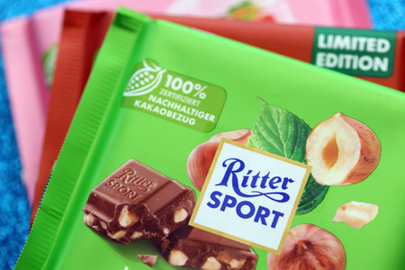 KYIV, UKRAINE - AUGUST 17, 2024 Ritter Sport logotype on small chocolate bar in wrapping close upのeditorial素材