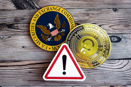 KYIV, UKRAINE - AUGUST 17, 2024 PolkaDot coin and red paper attention sign with Securities and Exchange Commission on wooden background close upのeditorial素材