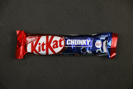 KYIV, UKRAINE - AUGUST 17, 2024 Kitkat chunky chocolate waffle bar in logo on wrapping close upのeditorial素材