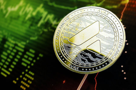 KYIV, UKRAINE - AUGUST 17, 2024 Avalanche AVAX coin on dark cryptocurrency digital trading chart in green and red colors close upのeditorial素材