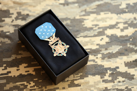 KYIV, UKRAINE - JULY 10, 2024 US Army Medal Of Honor. Highest United States military award medal with ribbon and pin. Handmade paper theater props close upのeditorial素材