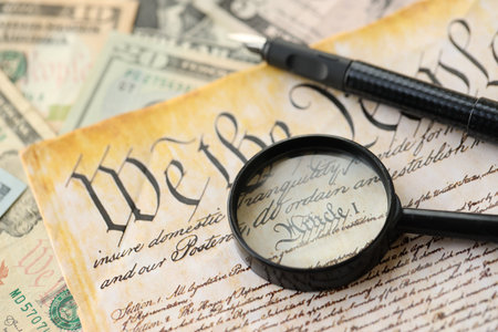 American USA Constitution paper page and magnifying glass close up. We The Peopleの写真素材